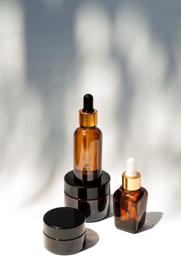 Serum Bottles and Black Cosmetic Containers